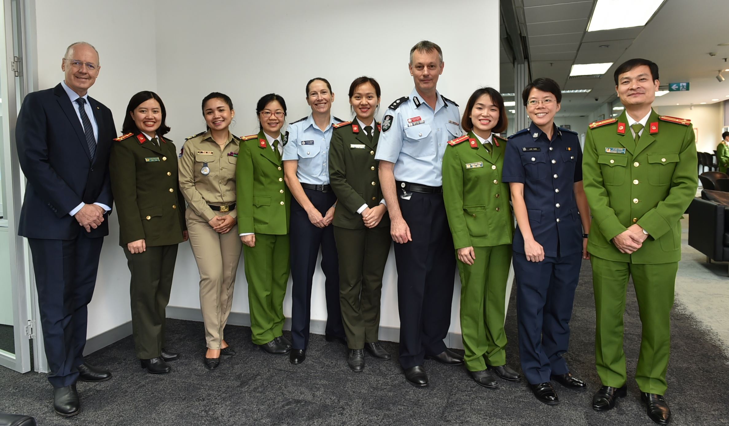 AFP Acting Commander Paula Hudson (centre) alongside ARLEMP members and partners including Mr Phillip Dowler and Associate Professor Mathews Nkhoma (RMIT Vietnam), and Detective Superintendent Roger Brown (AFP). 