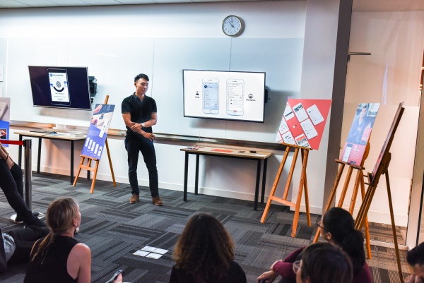A student presents his design for a mobile application which aims to connect users and mechanics upon request.