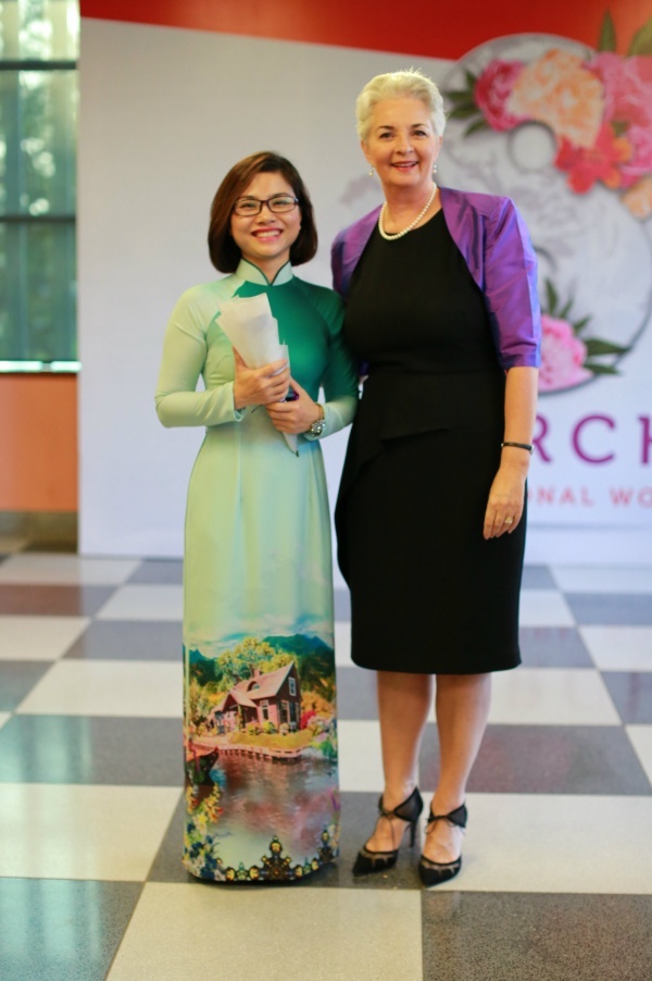 Professor Gael McDonald gave flowers to staff at International Women’s Day celebration party.