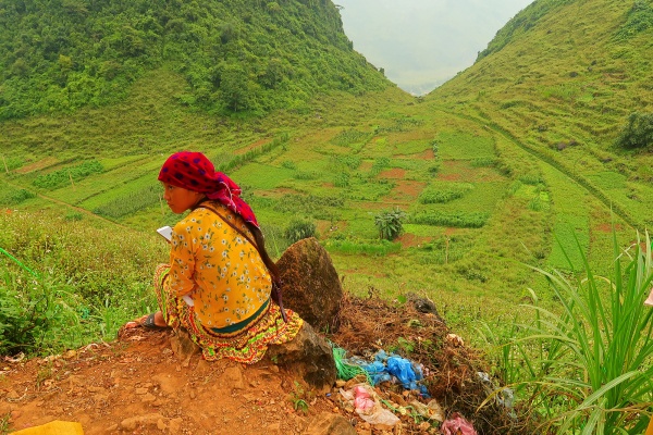 Hmong and Dao women wear their traditional dresses in daily life.