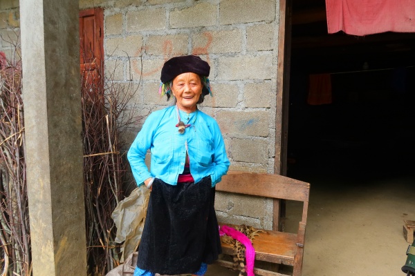 Hmong and Dao women wear their traditional dresses in daily life.