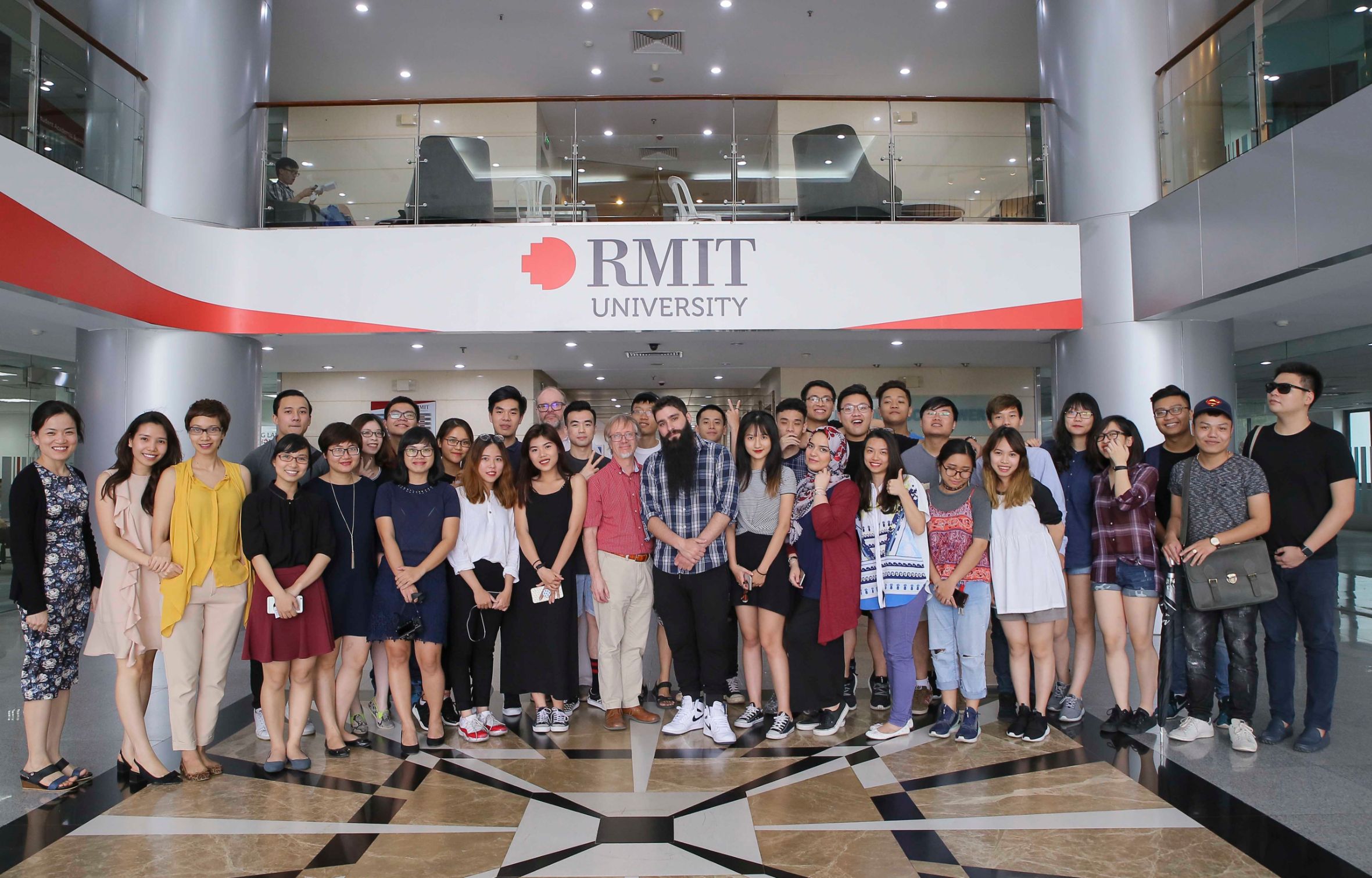 Mr Vogt-Roberts with students and staff at RMIT Vietnam's Hanoi City campus.