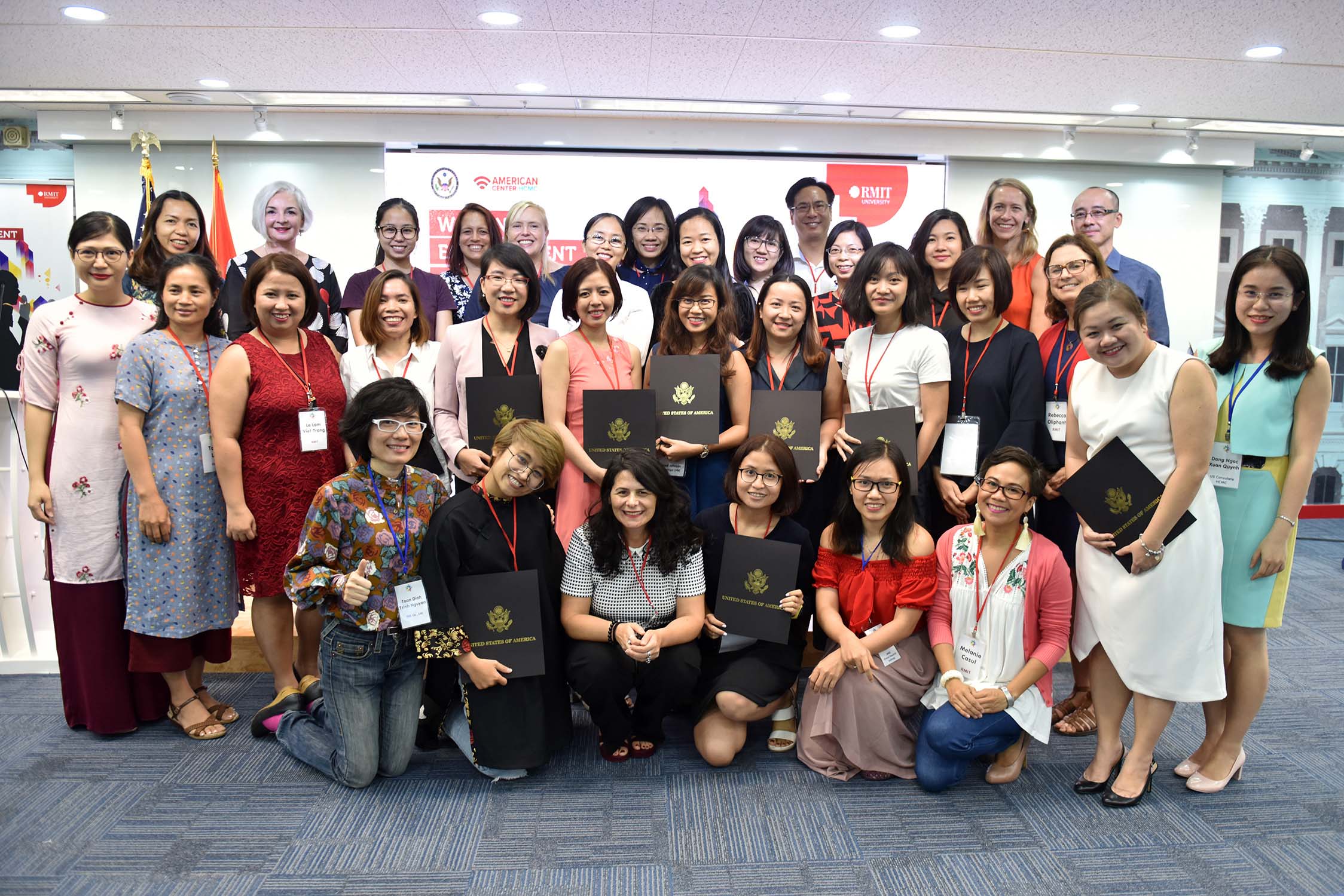 Executive Assistant and Youth Leader Le Tran Ngoc Minh (pictured centre row, sixth from left) with graduating WEC group members and facilitators