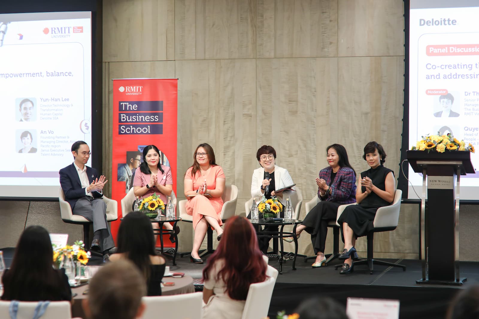 Six panellists on stage