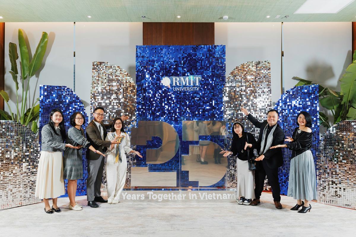 RMIT Vietnam staff celebrating the University’s 25th anniversary at the 2025 New Year party. (Photo: RMIT)