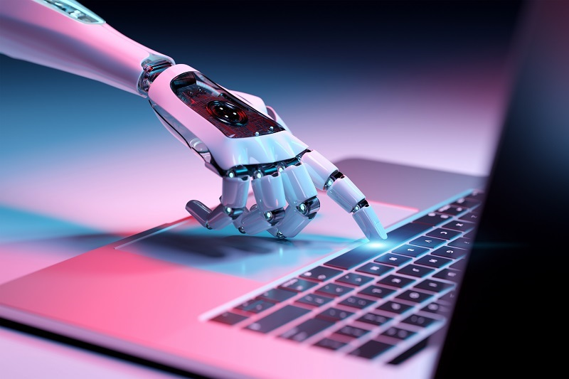 Robot hand touching laptop keyboard