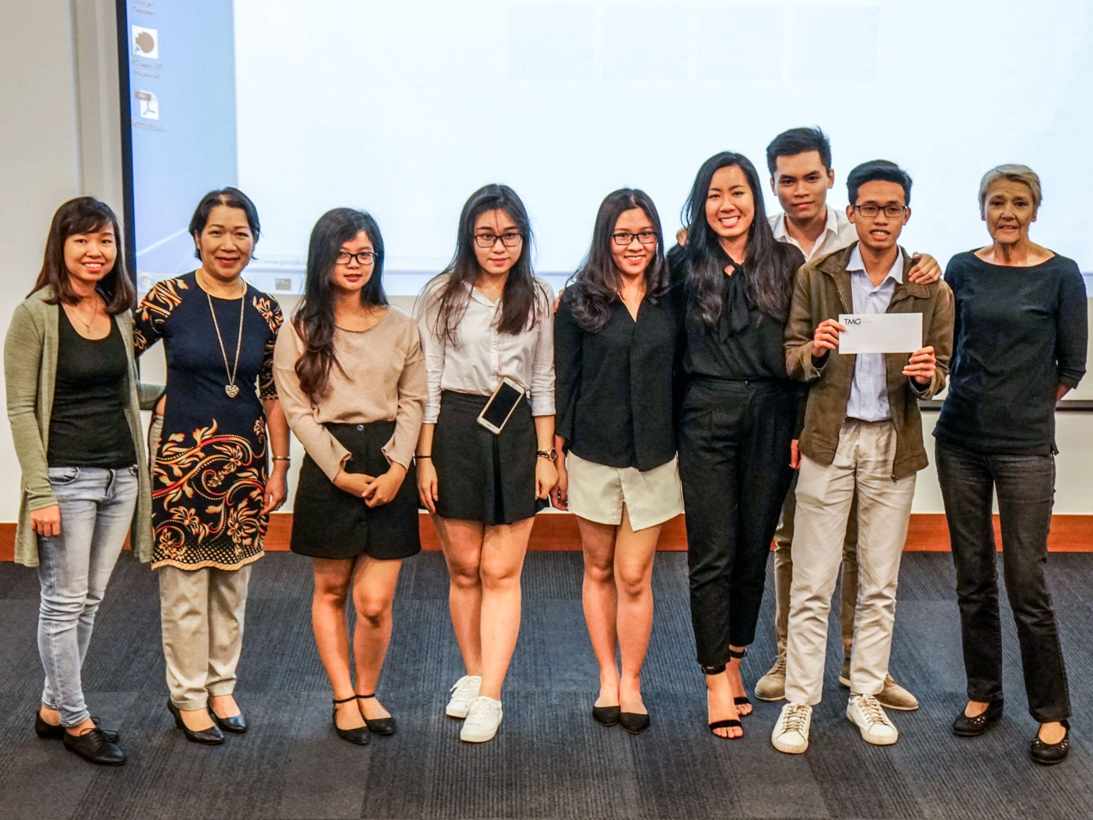 RMIT Vietnam Lecturer Nguyen Anh Thu (second from left) and her students at the presentation to Victoria Hotels and Resorts' representatives.