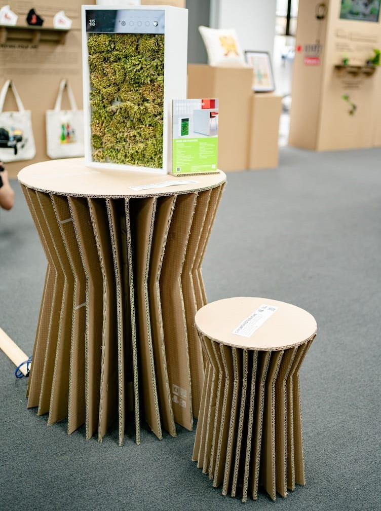 A furniture set made of recycled cardboard boxes previously containing electronic devices.