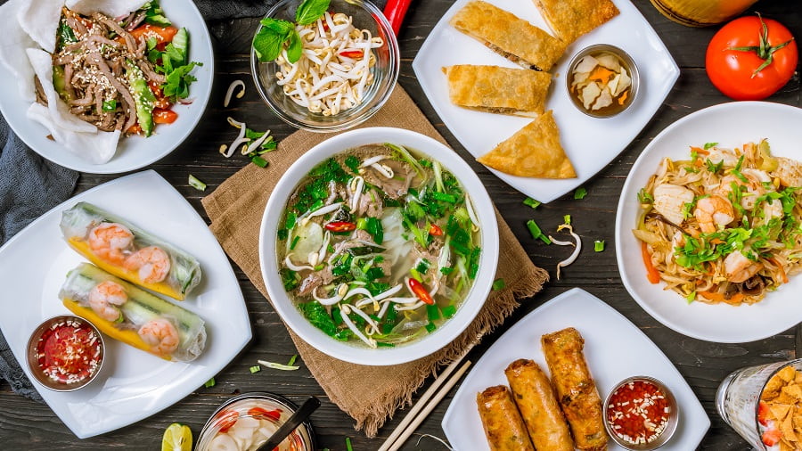 A table full of different Vietnamese dishes