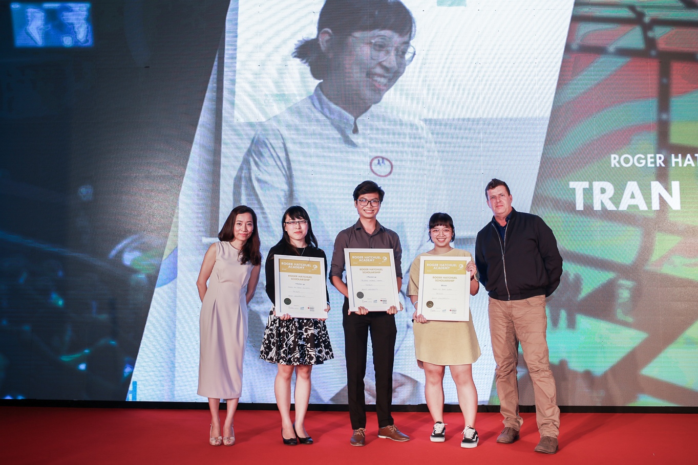 Tran Le Bao Quan (second from right) received the Roger Hatchuel Academy scholarship at the Vietnam Young Lions 2017 Award Ceremony. From left to right: Pham Dieu Anh (Managing Director of AIM Academy), Tran Thi Thao Nguyen (scholarship finalist), Truong Hoang Nhan (scholarship finalist), Tran Le Bao Quan (Roger Hatchuel scholarship winner), Professor Rick Bennett (Head of Centre, RMIT Vietnam Centre of Communication & Design).