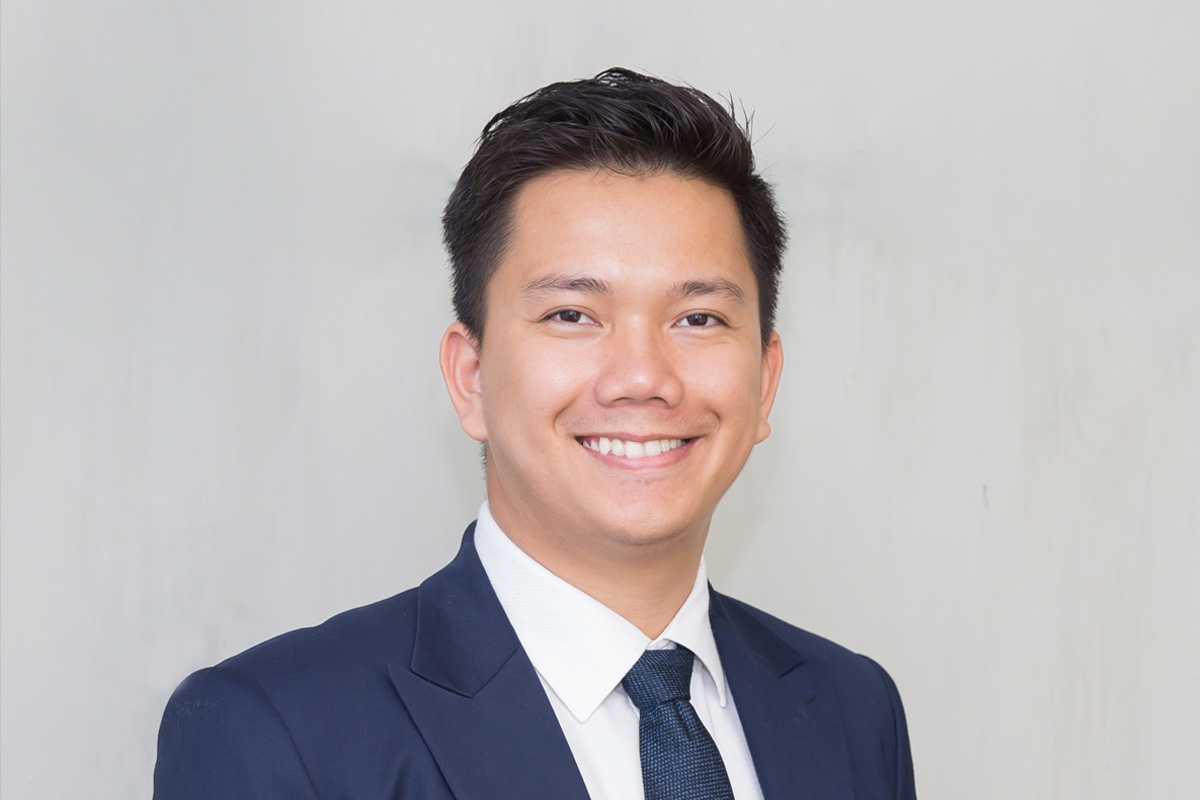 headshot of a man smiling