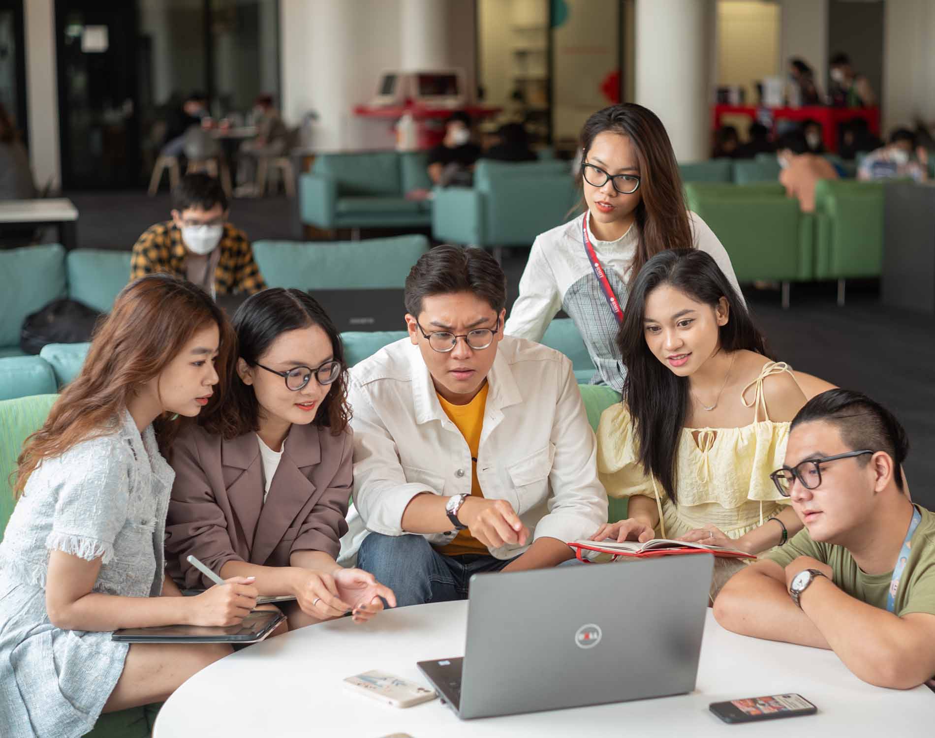 six students discussing work