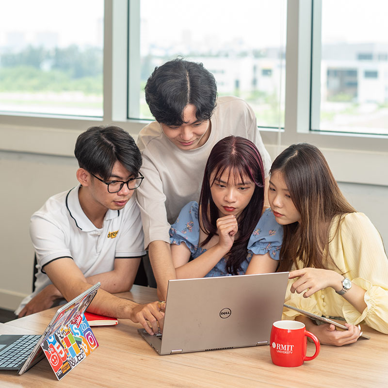 Group of students watching the laptop together