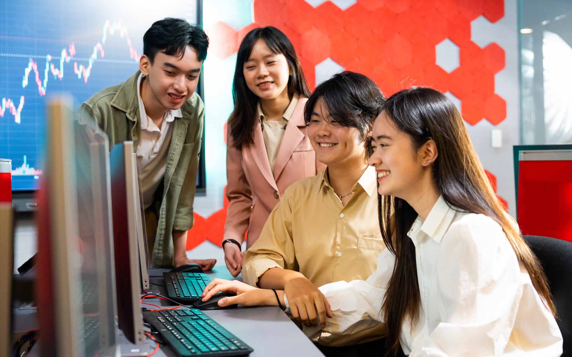 four students discussing on a computer screen