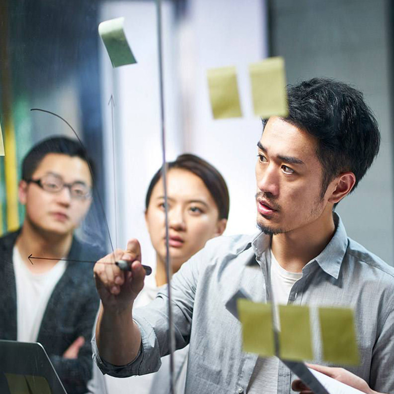 A men writing on the board