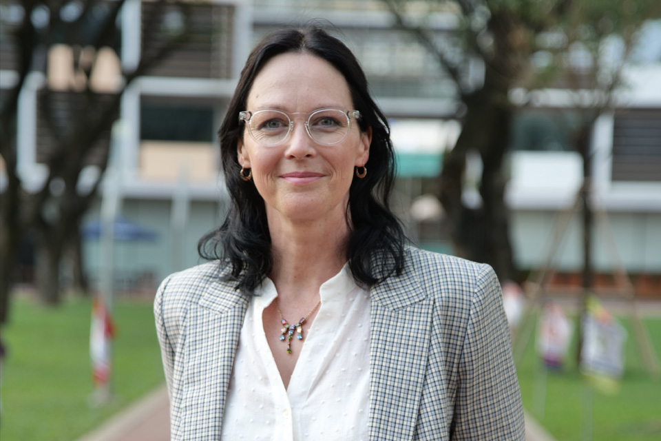 a headshot of a woman smiling 