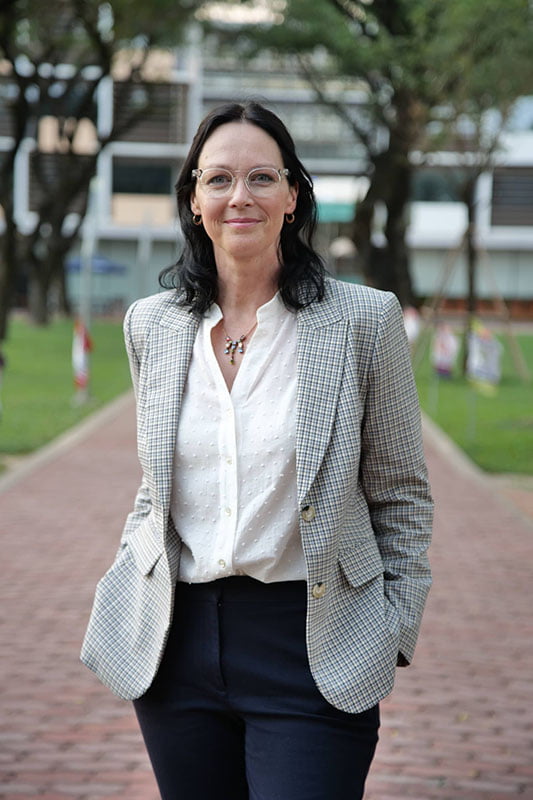 a headshot of a woman smiling 