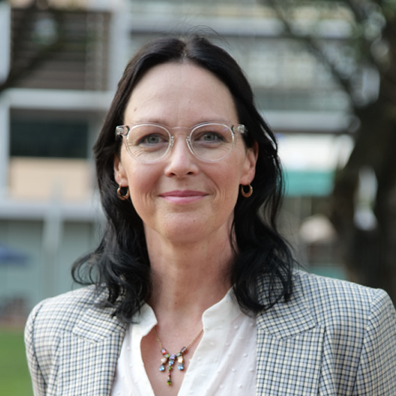 a headshot of a woman smiling 