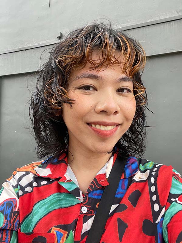 a headshot of a woman smiling 