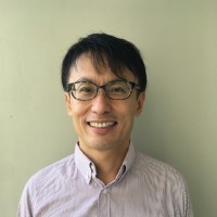 headshot of a man smiling