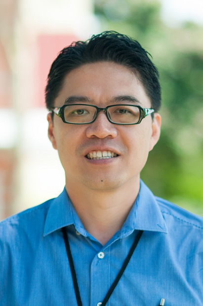 headshot of a man smiling