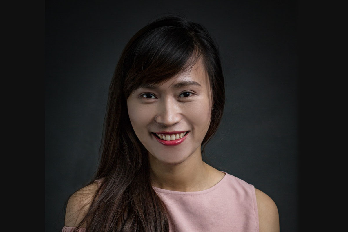 a headshot of a woman smiling 