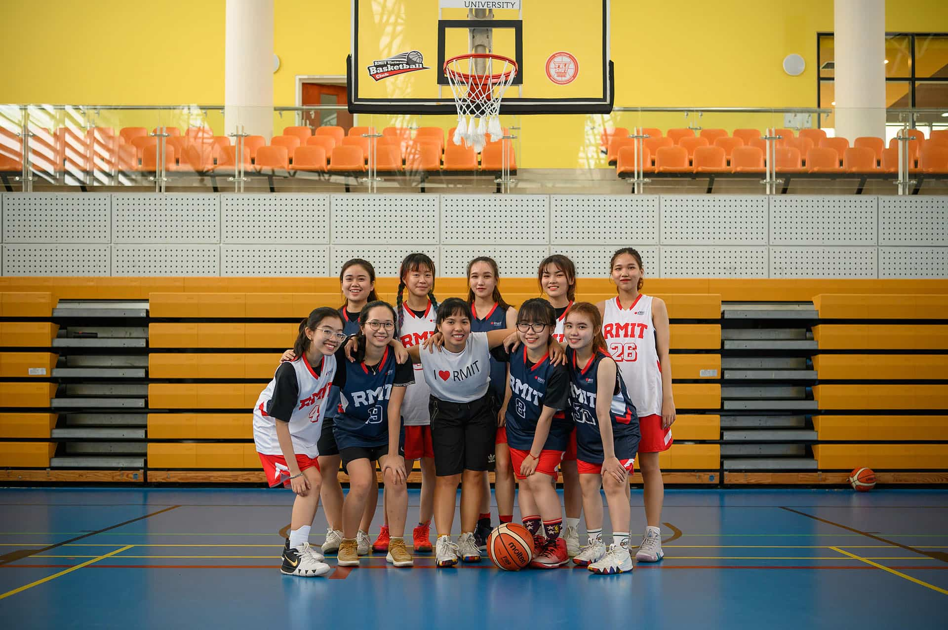 SGS female basketball club standing together.