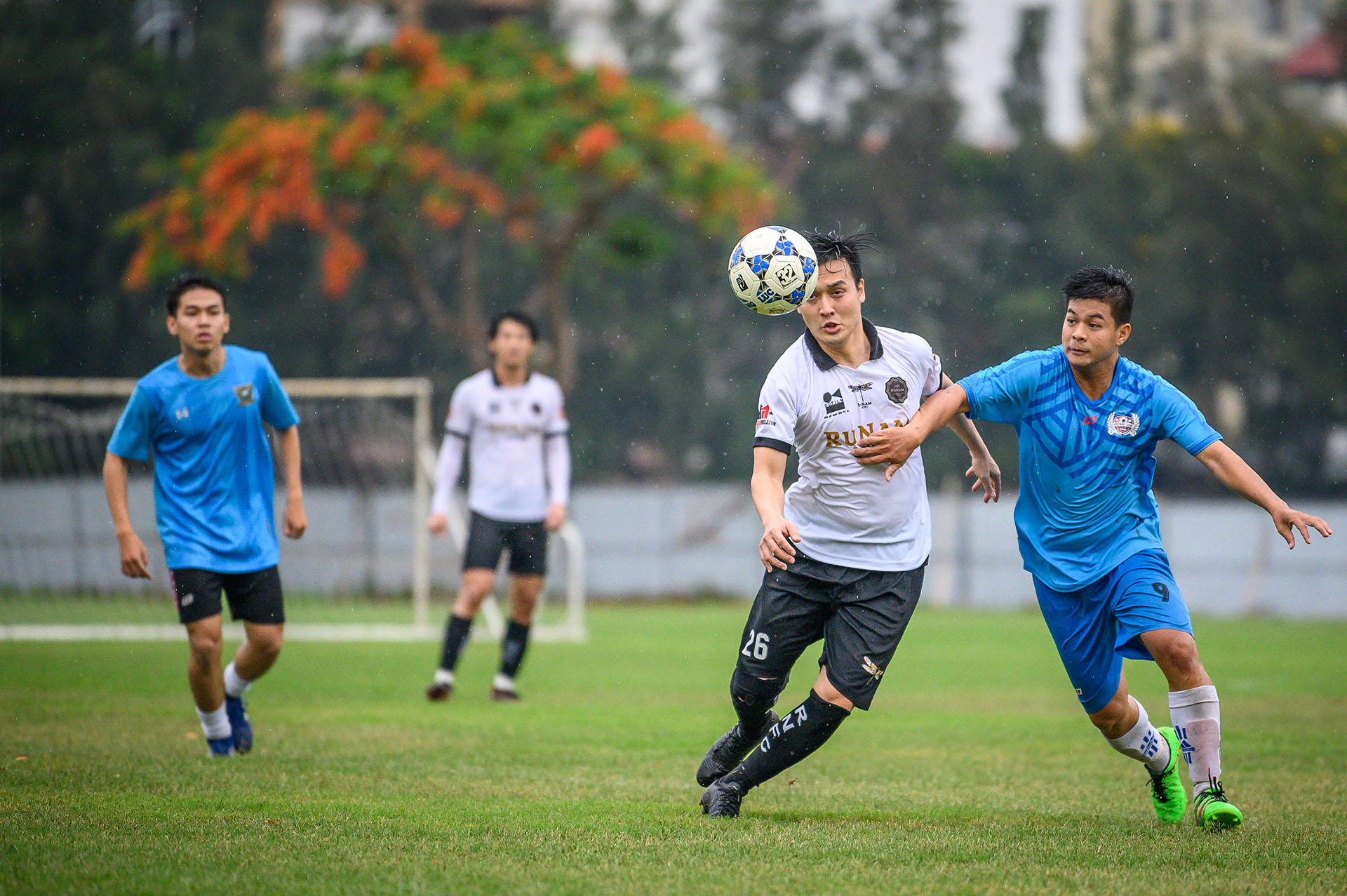 Men playing football (soccer)